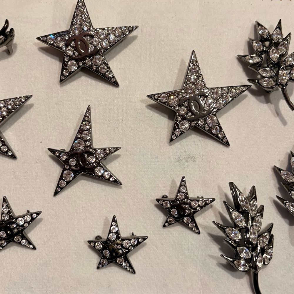 crystal-encrusted star and leaf motif costume jewelry brooches